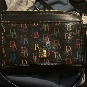 Dooney & Bourke Multi Color Crossbody black leather Inside key hook .